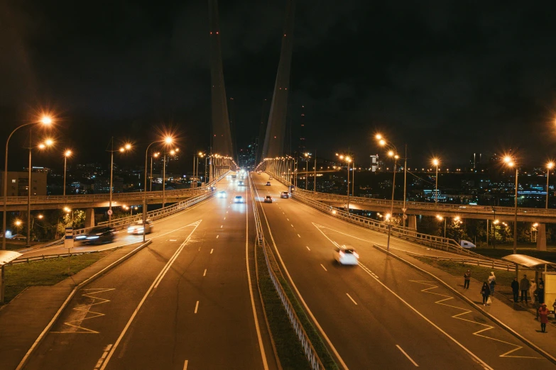 a city street filled with lots of traffic at night, pexels contest winner, hurufiyya, bridge, 000 — википедия, wide roads, symmetrical image