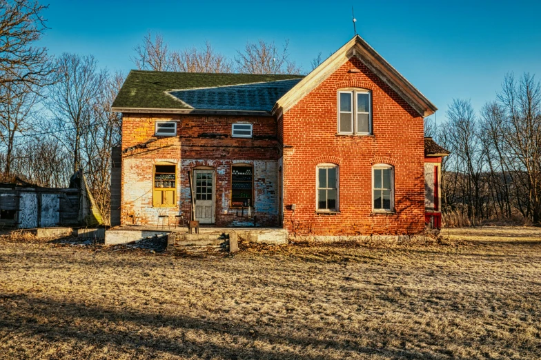 a red brick house sitting in the middle of a field, by Robert Storm Petersen, pexels contest winner, in a old house. hyper realistic, midwest town, front lit, built on a small