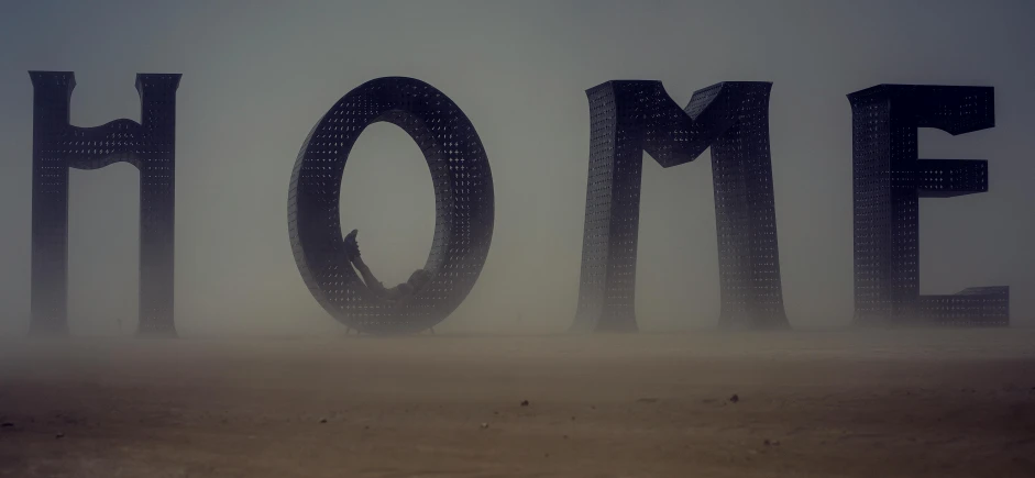 a person standing in front of the word home, by Dom Qwek, pexels contest winner, romanticism, mad max dust storm, metal sculpture, epic 3 d omolu, volumetric fog and haze