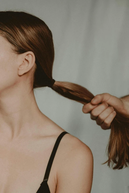 a woman getting her hair styled by a hair stylist, by Olivia Peguero, tight around neck, looking at each other mindlessly, ponytail, neck zoomed in