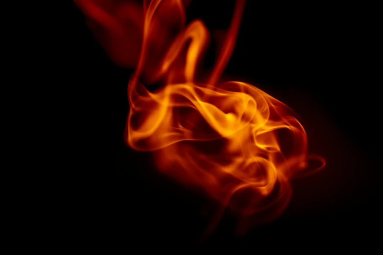 a close up of a fire on a black background, pexels, avatar image, red and orange colored, instagram post, flare