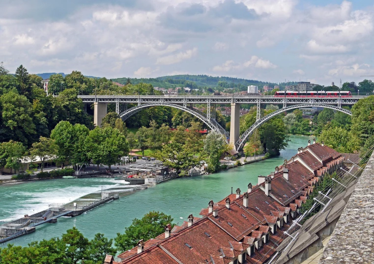 a train traveling over a bridge over a river, inspired by Karl Stauffer-Bern, pexels contest winner, renaissance, panorama view, wheres wally, skybridges, post+processing