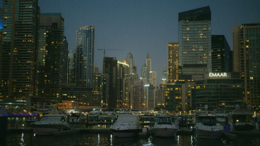 a harbor filled with lots of boats next to tall buildings, pexels contest winner, hyperrealism, arabian night, documentary still, 2000s photo, fan favorite