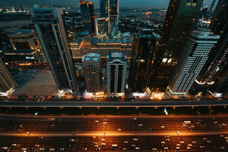 an aerial view of a city at night, pexels contest winner, hurufiyya, dubai, dusk on a city street, thumbnail, hyperdetailed