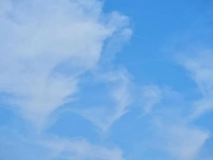 a person is flying a kite in the sky, by Jan Rustem, wispy clouds in a blue sky, white and pale blue, viewed from a distance, low detail