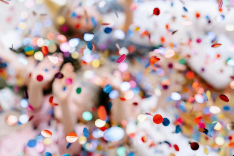 a woman laying on a bed covered in confetti, by Julia Pishtar, pexels contest winner, super close up shot, petra cortright, round-cropped, 15081959 21121991 01012000 4k