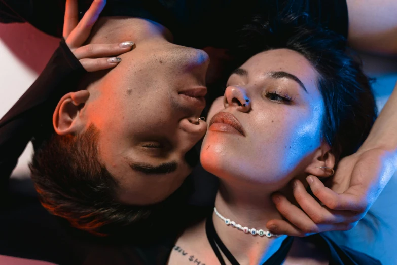 a man and a woman laying on top of each other, inspired by Elsa Bleda, trending on pexels, hyperrealism, soft devil queen madison beer, night life, glossy lips, unsplash photo contest winner