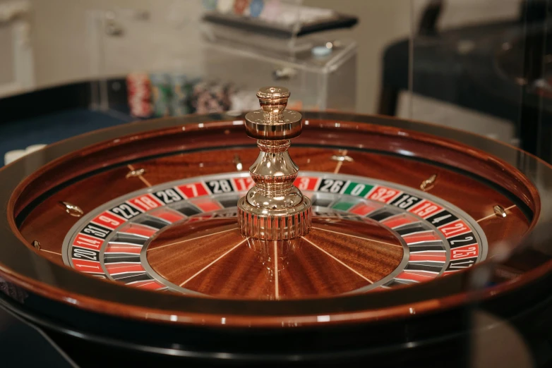 a close up of a roulet wheel on a table, by Emma Andijewska, pexels contest winner, hyperrealism, casino, 15081959 21121991 01012000 4k