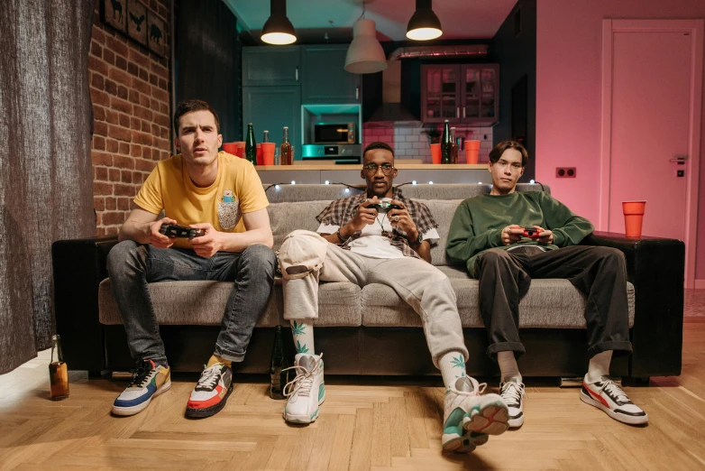 a group of men sitting on top of a couch, pexels, maximalism, gamer themed, duck shoes, avatar image, indoor shot