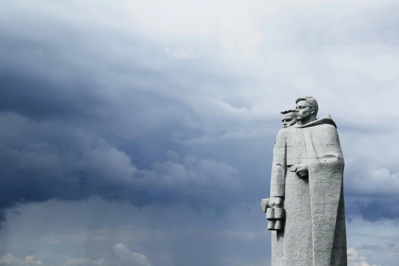 a statue of a man standing in front of a cloudy sky, by Jaakko Mattila, unsplash, socialist realism, large stone statues of heroes, white, lenin, background image