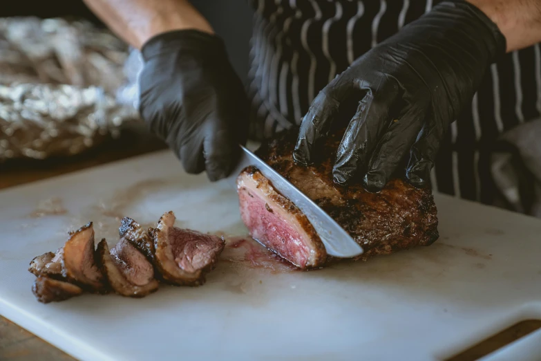 a close up of a person cutting meat on a cutting board, by Joe Bowler, pexels contest winner, renaissance, 🦩🪐🐞👩🏻🦳, plating, inside a grand, thick lining