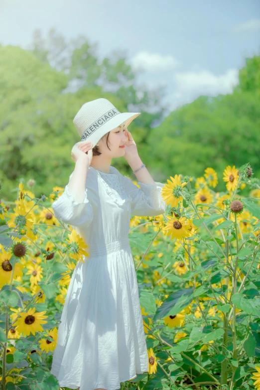 a woman standing in a field of sunflowers, by Eizan Kikukawa, unsplash, romanticism, white straw flat brimmed hat, 2022 photograph, 8 k )