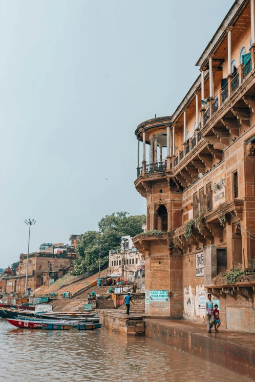 a couple of boats that are in the water, by Peter Churcher, trending on unsplash, renaissance, on an indian street, built on a steep hill, in balcony of palace, panoramic