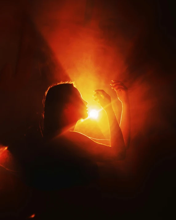 a person that is standing in the dark, flare, fire from mouth, lgbtq, orange light