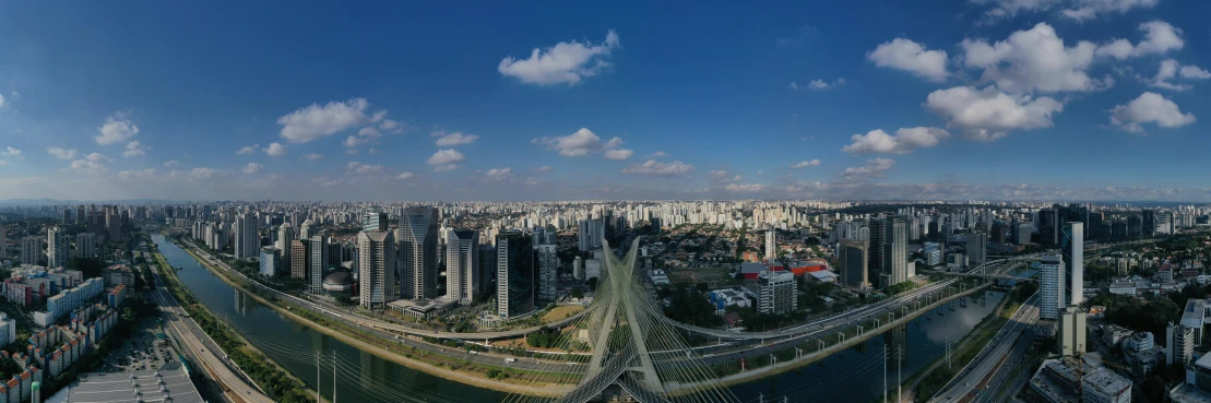 a view of a city from the top of a building, by Felipe Seade, all buildings on bridge, ultrawide image, slide show, beautiful day