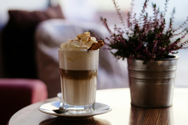 a cup of coffee sitting on top of a table, milkshake, decadent, jasmine, thumbnail