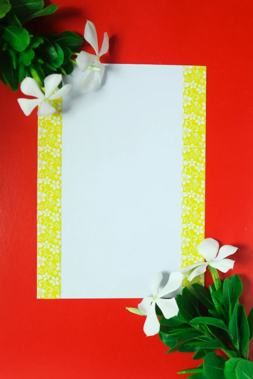 a blank paper with white flowers on a red background, colors: yellow, risograph print, plumeria, product image