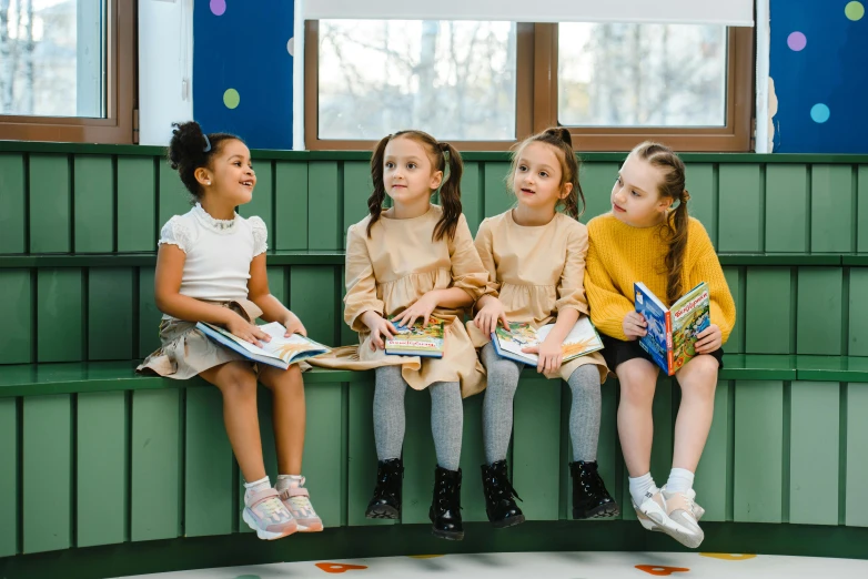 a group of children sitting next to each other on a bench, pexels contest winner, danube school, beautiful girls, sitting in a waiting room, girl wearing uniform, storybook style