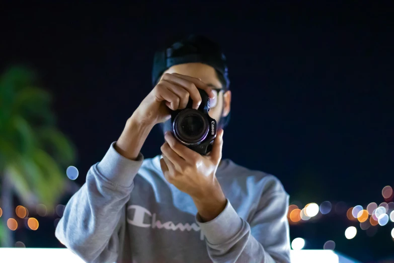 a man taking a picture with a camera, by Robbie Trevino, night time footage, profile picture, smooth.sharp focus, riyahd cassiem