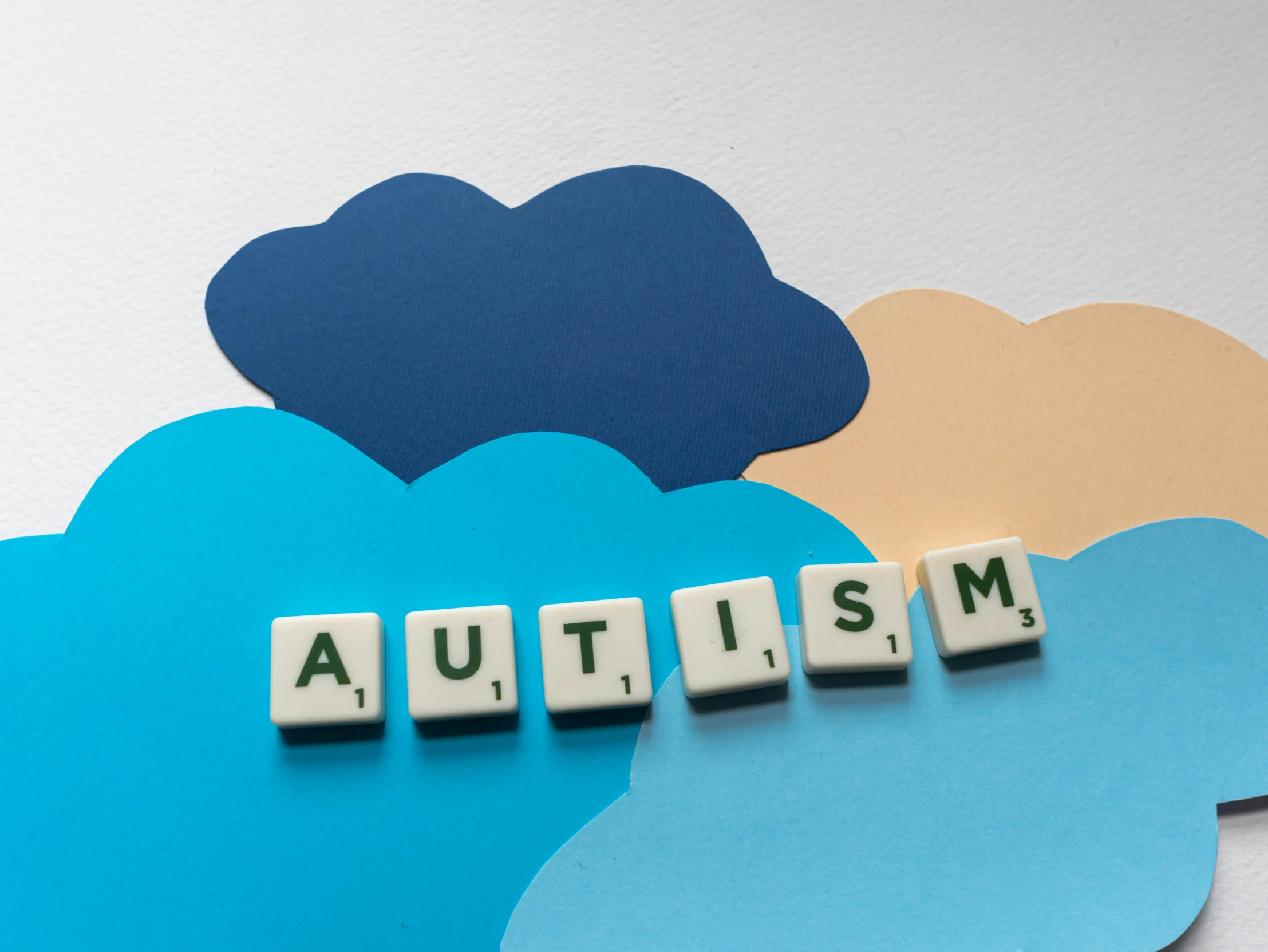 the word autism spelled in scrabbles on top of a cloud, trending on pexels, aestheticism, background image, amanda clarke, children's, nfts