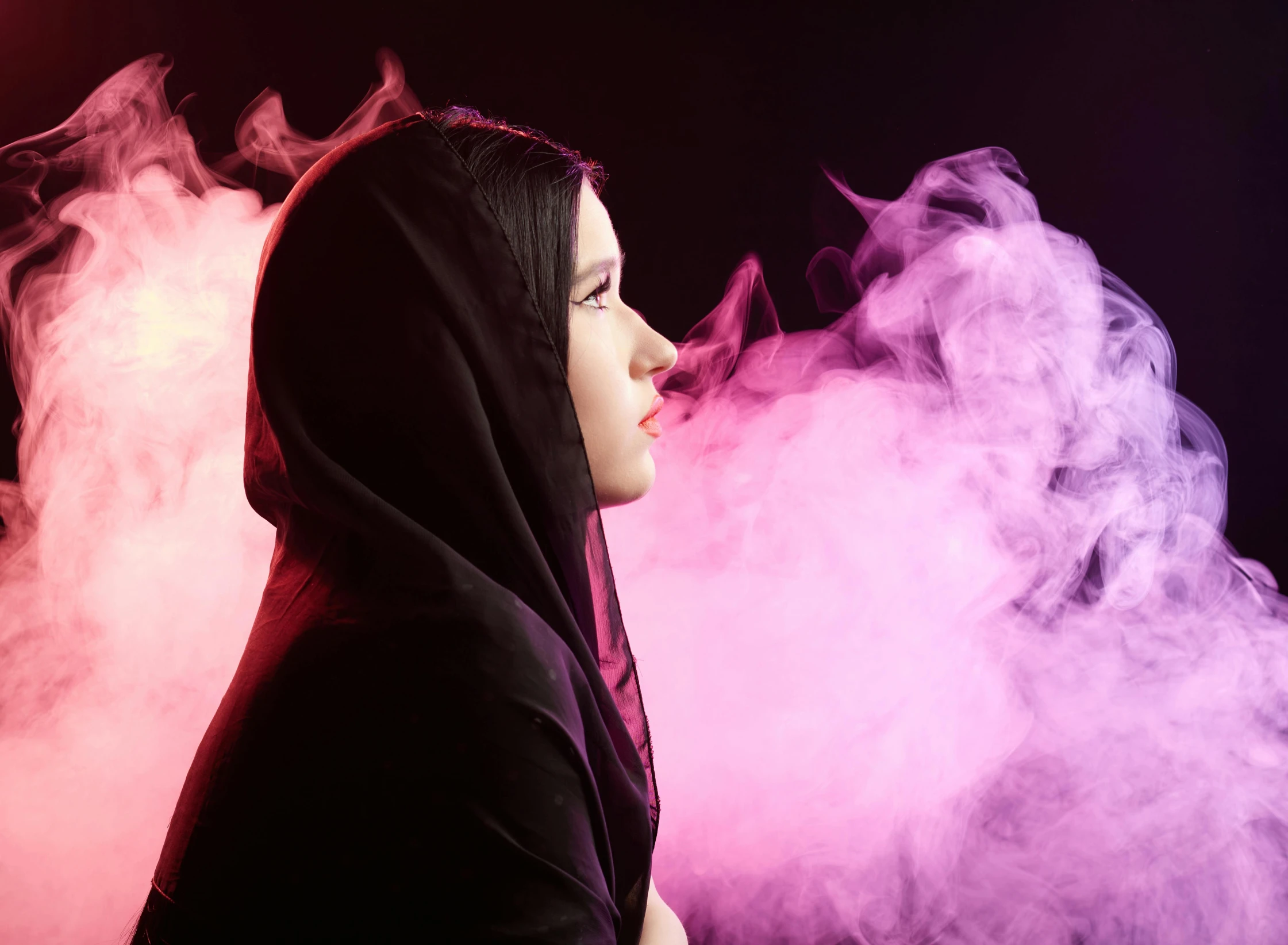 a woman in a hoodie smoking a cigarette, an album cover, by Julia Pishtar, pexels contest winner, romanticism, beautiful burqa's woman, thick colorful smoke, nun fashion model looking up, pink mist