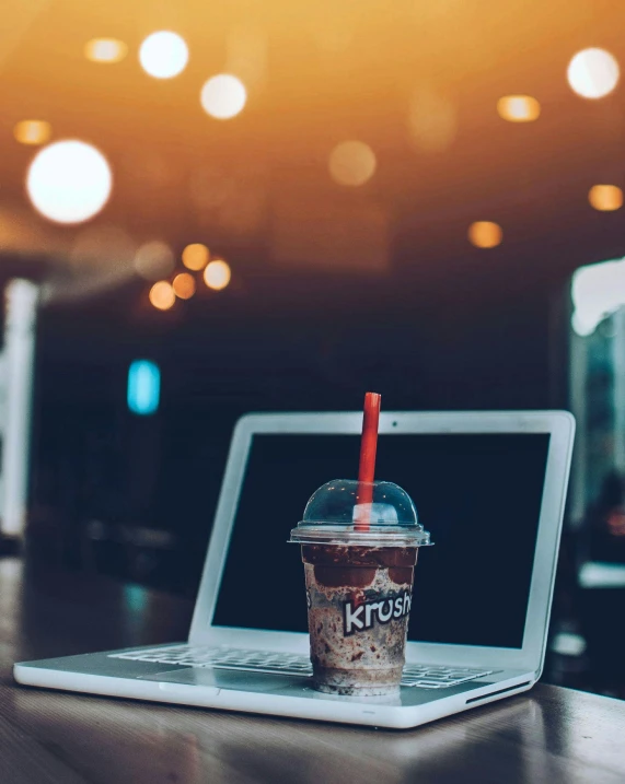 a laptop computer sitting on top of a wooden table, by Byron Galvez, unsplash, realism, milkshake, krystal, square, lgbtq