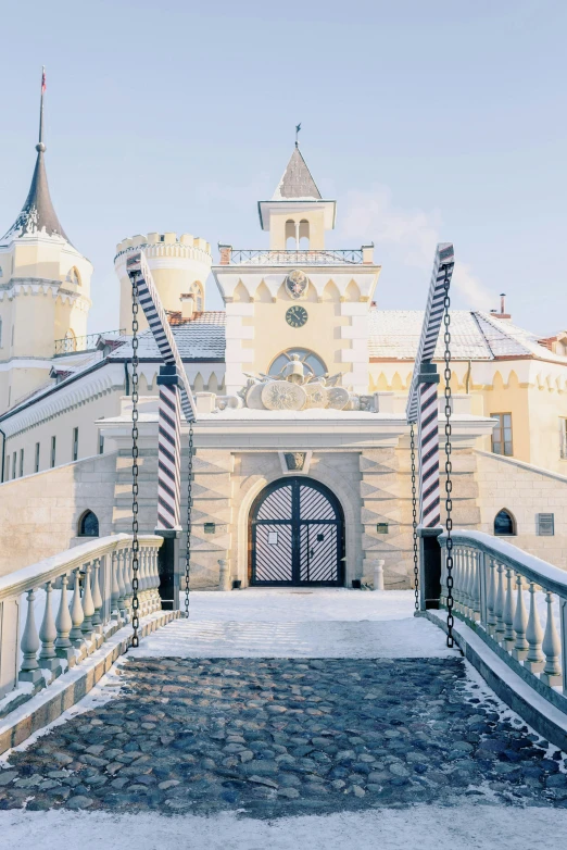 a snow covered bridge with a castle in the background, large gate, baroque architecture, profile image