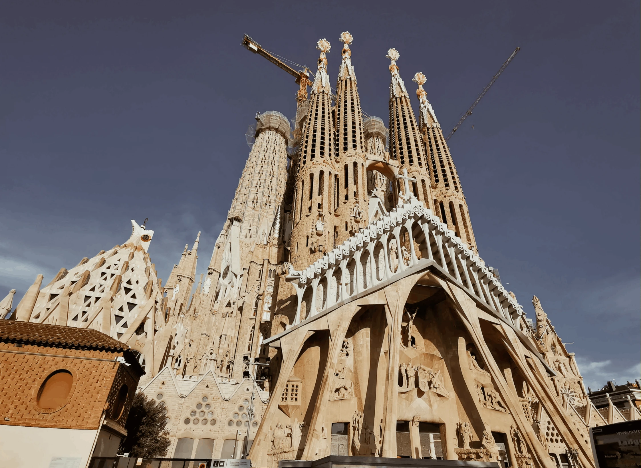 a car that is parked in front of a building, by Gaudi, pexels contest winner, tall spires, freddy mamani silvestre facade, construction, 15081959 21121991 01012000 4k