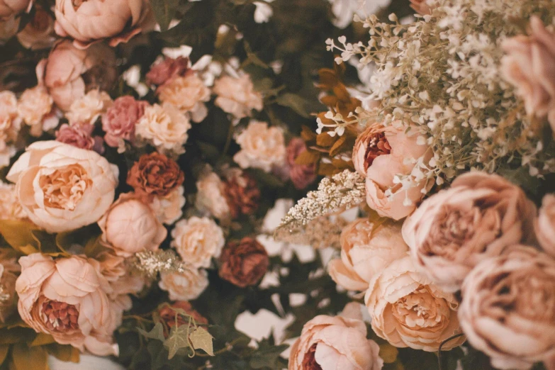 a bunch of flowers sitting on top of a table, by Emma Andijewska, trending on unsplash, romanticism, brown and pink color scheme, rose garden, tufted softly, rose gold