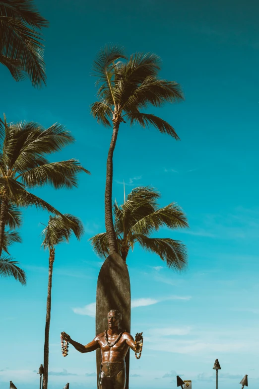 a man standing on top of a surfboard next to palm trees, towering over your view, multiple stories, hawaii, uploaded