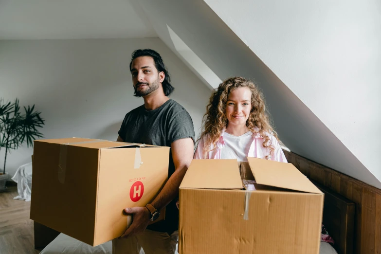 a man and a woman holding boxes in their hands, by Carey Morris, pexels contest winner, manuka, charli bowater and artgeem, avatar image, airbnb