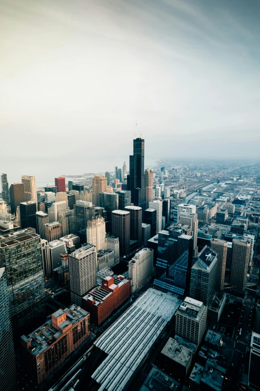 a view of a city from the top of a building, by Andrew Domachowski, pexels contest winner, happening, chicago skyline, tall buildings in background, aerial, panoramic