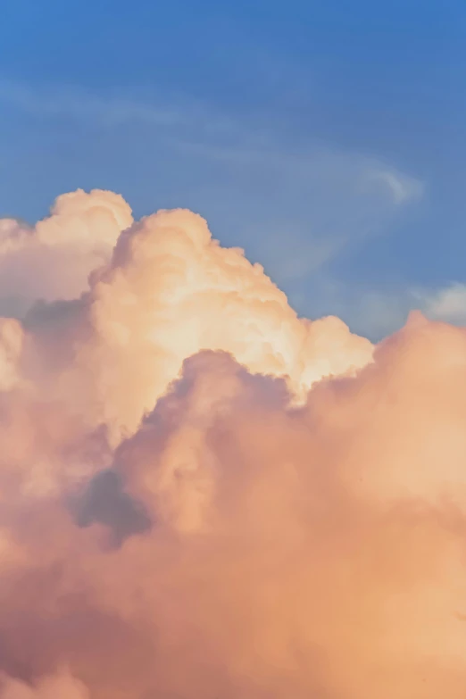 a jetliner flying through a cloudy blue sky, an album cover, by Carey Morris, unsplash, romanticism, cotton candy clouds, profile image, late summer evening, giant cumulonimbus cloud
