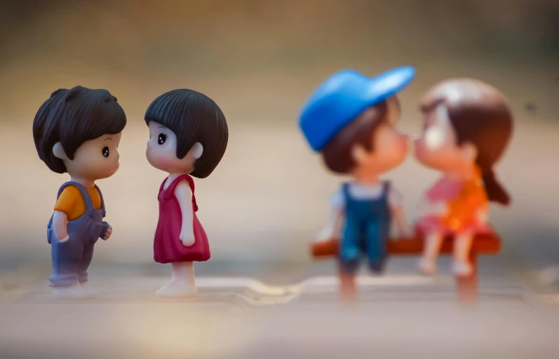 a couple of figurines standing next to each other, inspired by Nara Yoshitomo, pexels contest winner, peasant boy and girl first kiss, paul barson, plastic toy, friendship