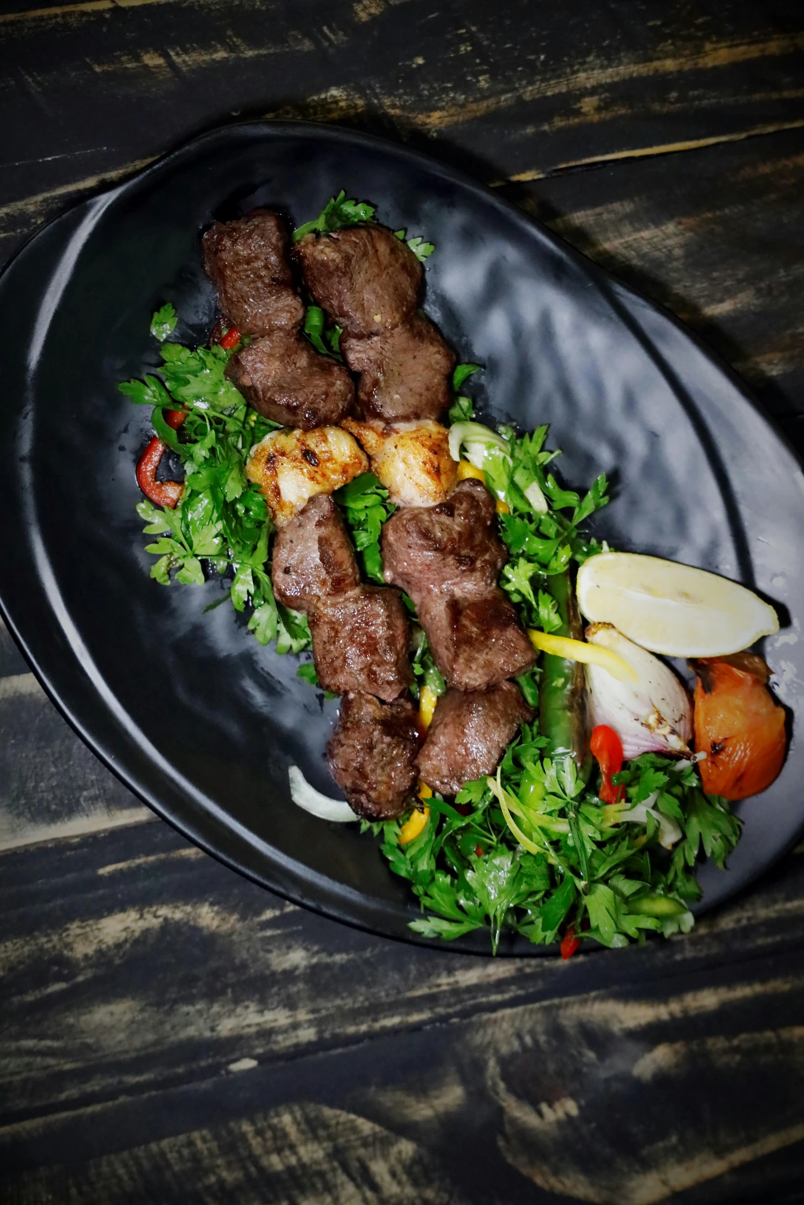 a close up of a plate of food on a table, kebab, lush greens, profile image, 6 pack