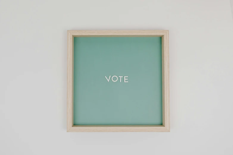 a wooden frame with the word vote written on it, by Olive Mudie-Cooke, trending on unsplash, sea green color theme, ffffound, square pictureframes, limited edition print