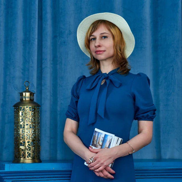 a woman in a blue dress and a white hat, a portrait, by Julia Pishtar, journalism photo, in russia, golden blue outfit, 15081959 21121991 01012000 4k