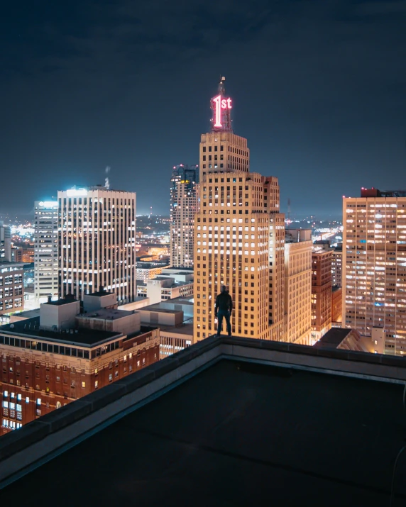 a person standing on top of a building at night, by Greg Rutkowski, unsplash contest winner, pixel art, cleveland, taken in the early 2020s, high light on the left, instagram picture