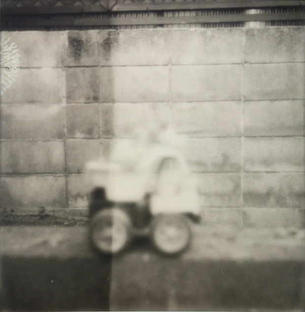 a black and white photo of a toy car, by Riusuke Fukahori, grainy polaroid, ghostly, street photograph, chariot