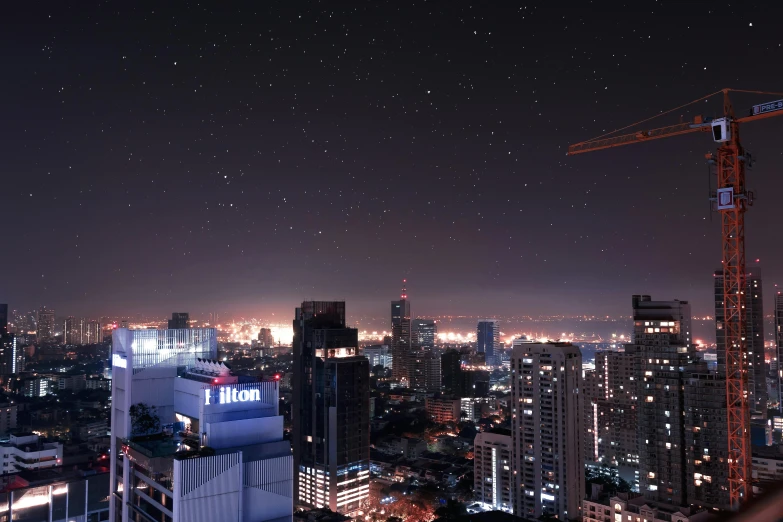 a view of a city at night from a high rise building, a matte painting, pexels contest winner, starry sky 8 k, bangkok, helicopter view, high res photograph