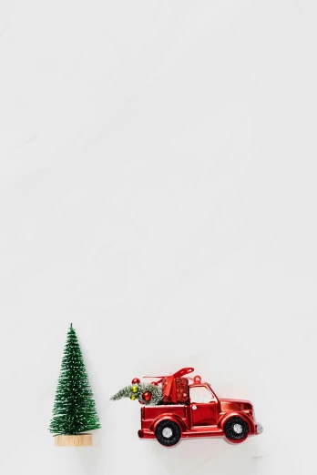 a red truck with a christmas tree in the back, a picture, trending on pexels, fine art, on grey background, background image, color image, --n 6