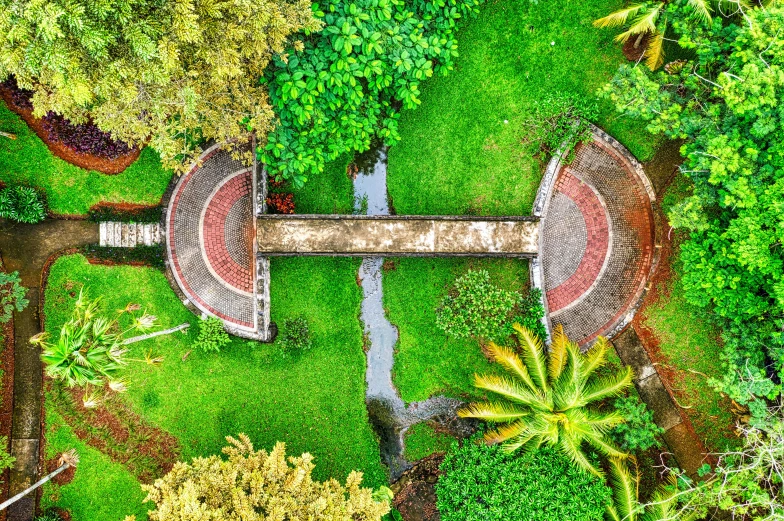 a small bridge in the middle of a lush green park, by Daniel Lieske, pexels contest winner, visual art, high angle uhd 8 k, reunion island, fountains and arches, top down perspecrive