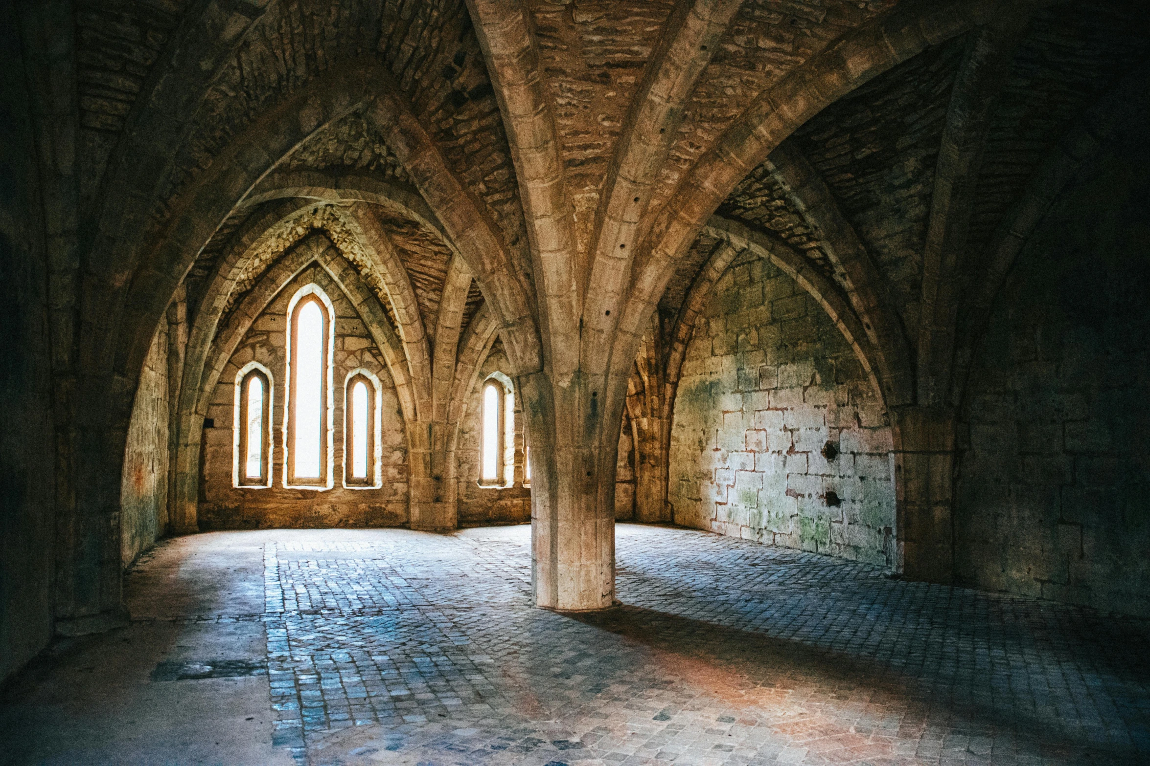 a room filled with lots of windows next to a brick floor, by Andrew Robertson, unsplash contest winner, romanesque, pointed arches, a medieval keep, 2 5 6 x 2 5 6 pixels, palace of the chalice
