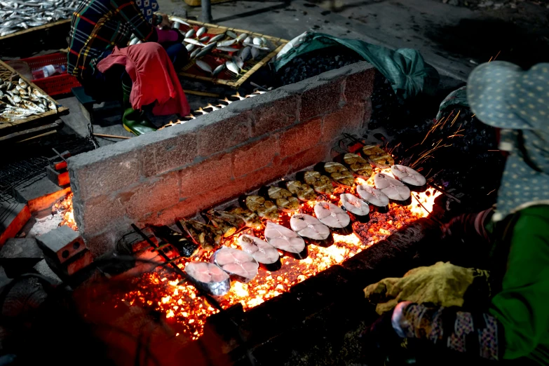 a person that is cooking some food on a grill, by Alejandro Obregón, hurufiyya, the masks come off at night, fish, thumbnail, rectangular