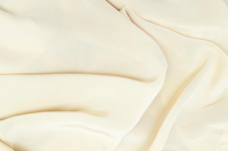 a close up of a white cloth on a table, pale yellow sky, vanilla, detailed product image, silk colors