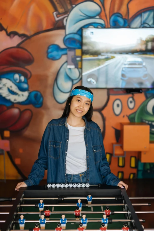 a woman standing in front of a foo foo foo foo foo foo foo foo foo foo foo, an airbrush painting, graffiti, teal headband, standing in a restaurant, young asian woman, tabletop gaming