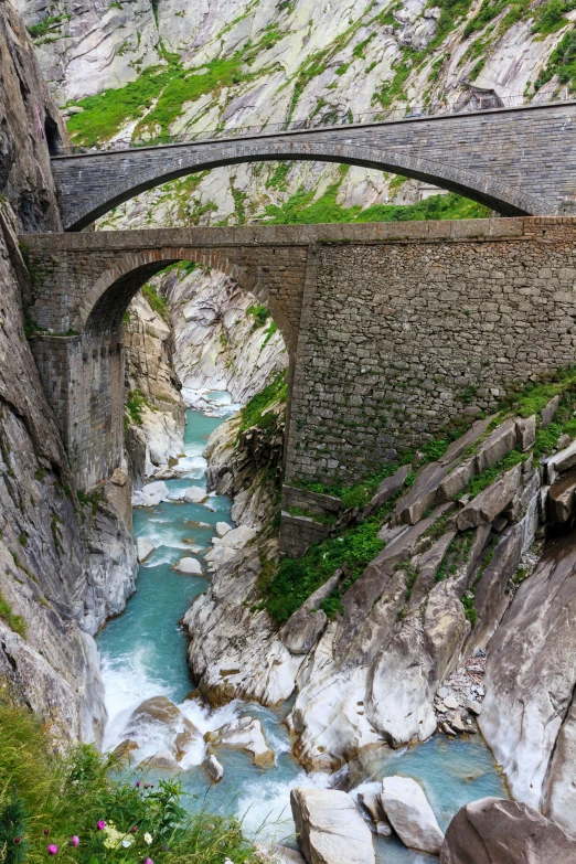 a train traveling over a bridge over a river, inspired by Otto Meyer-Amden, pexels contest winner, renaissance, carrara marble, huge chasm, 2 5 6 x 2 5 6 pixels, alps