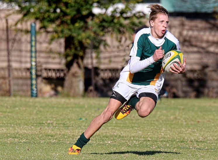 a man running with a rugby ball in his hand, by Hubert van Ravesteyn, flickr, 1 6 years old, 15081959 21121991 01012000 4k, instagram post, greens)