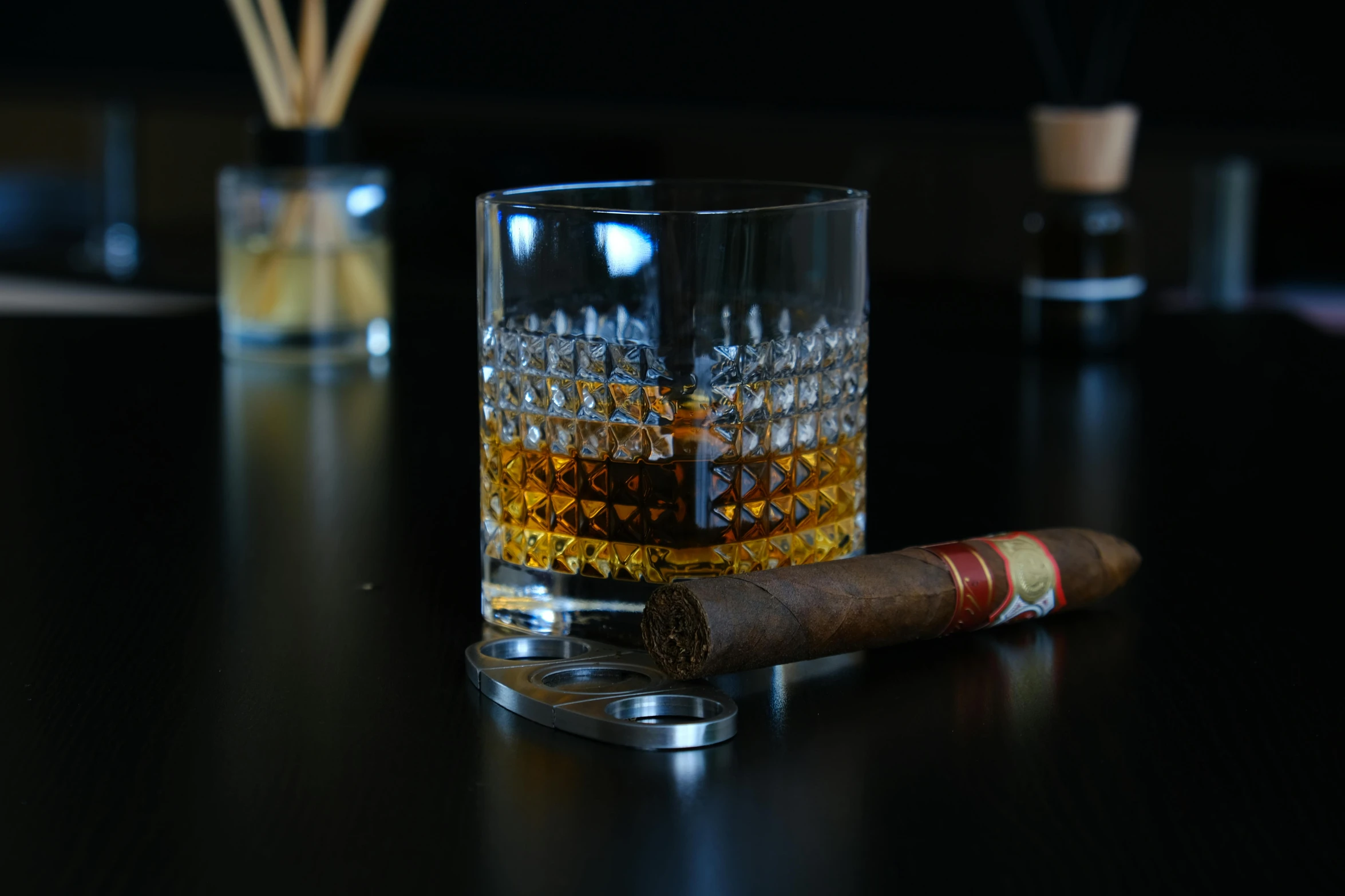 a cigar and a glass of whiskey on a table, inspired by William Grant Stevenson, unsplash, hyperrealism, fan favorite, glass and gold pipes, jamaica, highly intricate