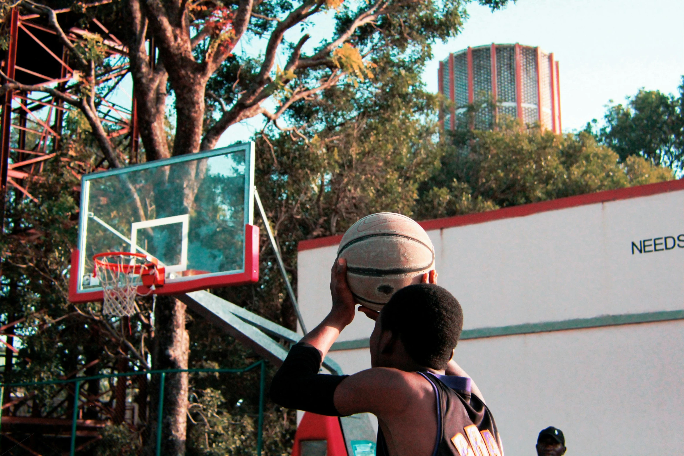 a couple of men playing a game of basketball, an album cover, pexels contest winner, panorama shot, edward buba, exterior shot, taken in the late 2010s